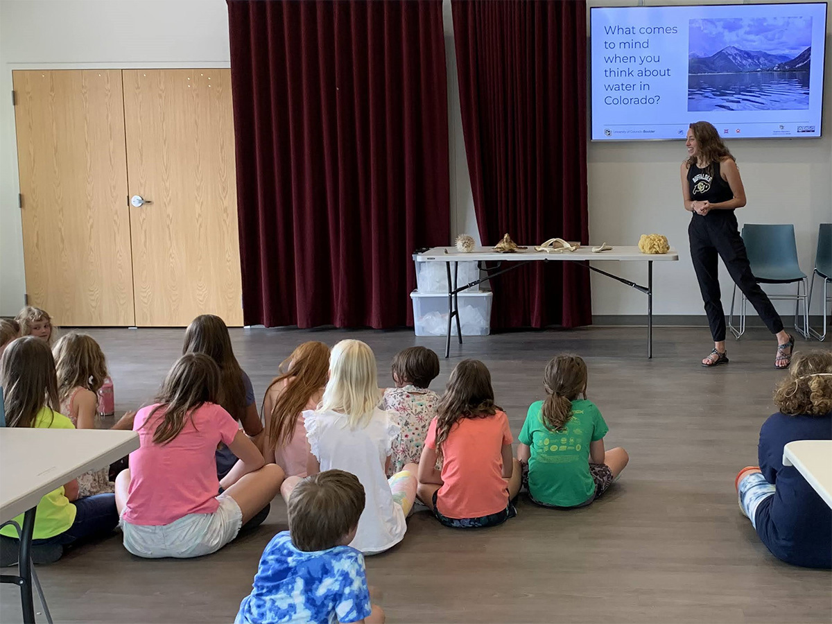 Aislyn Keyes presenting to a group of students