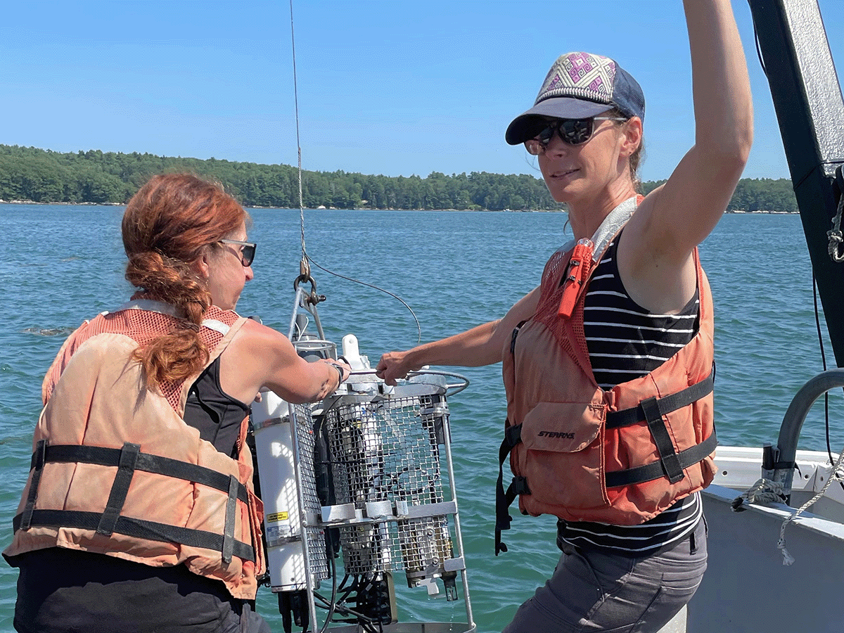 SRS Karen Stamieszkin with a student preparing an instrument to collect seawater samples